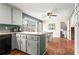 Eat-in kitchen featuring gray cabinets, stainless appliances and a dining area at 610 Amberwood Pl, Euharlee, GA 30145