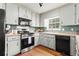 Well-equipped kitchen with stainless steel appliances and good counter space at 610 Amberwood Pl, Euharlee, GA 30145