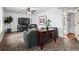 Cozy living room with a large TV, comfortable seating, and stylish decor at 610 Amberwood Pl, Euharlee, GA 30145