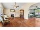 Spacious living room with hardwood floors, fireplace, and a seamless flow into the kitchen, perfect for entertaining at 610 Amberwood Pl, Euharlee, GA 30145