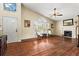 Bright living room with vaulted ceilings, fireplace, hardwood floors, and lots of natural light from the large windows at 610 Amberwood Pl, Euharlee, GA 30145