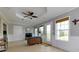 Inviting living room with coffered ceiling, tile floors, and ample natural light at 1164 Country Ct, Lawrenceville, GA 30044