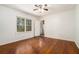 Bedroom features hardwood floors, a ceiling fan, and two points of entry at 1833 Ridgeland Dr, Decatur, GA 30032