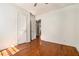 Bedroom with hardwood floors featuring a closet and doorway to the rest of the home at 1833 Ridgeland Dr, Decatur, GA 30032