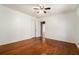 Bedroom with hardwood floors, ceiling fan, and an entry to an adjacent room at 1833 Ridgeland Dr, Decatur, GA 30032