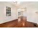 Cozy dining area with hardwood floors and a view into the living room and kitchen at 1833 Ridgeland Dr, Decatur, GA 30032