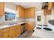 Functional kitchen with laminate countertops, wood cabinets, and white appliances at 1833 Ridgeland Dr, Decatur, GA 30032