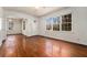 Open-concept living area boasts gleaming hardwood floors and lots of natural light at 1833 Ridgeland Dr, Decatur, GA 30032