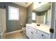 Bathroom with a white vanity, large mirror, and shower-tub combination at 5166 Ridge Tarn, Acworth, GA 30102