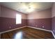 Bedroom featuring two-tone walls, wood flooring, and a ceiling fan at 5166 Ridge Tarn, Acworth, GA 30102