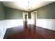 Dining room with wood floors, wainscoting, and chandelier lighting at 5166 Ridge Tarn, Acworth, GA 30102