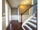 Inviting entryway features gleaming hardwood floors, paneled wainscoting, and a staircase with white railings at 5166 Ridge Tarn, Acworth, GA 30102