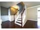 Welcoming entryway with rich hardwood floors and a staircase, creating an inviting first impression at 5166 Ridge Tarn, Acworth, GA 30102