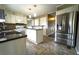 Kitchen with stainless steel appliances, granite countertops, and mosaic backsplash at 5166 Ridge Tarn, Acworth, GA 30102