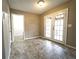 Open living room with French doors and tiled flooring at 5166 Ridge Tarn, Acworth, GA 30102