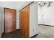 Modern entryway with concrete floors, and a sliding wooden barn door at 5200 Peachtree Rd # 3403, Atlanta, GA 30341