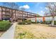 Apartment building exterior featuring manicured landscaping and architectural details at 5200 Peachtree Rd # 3403, Atlanta, GA 30341