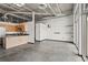 Spacious living area with open floor plan, modern kitchen and concrete flooring at 5200 Peachtree Rd # 3403, Atlanta, GA 30341