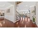 Inviting foyer with hardwood floors, stairway, and view into the spacious living area at 5910 Roxboro Ct, Cumming, GA 30040