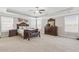 Spacious main bedroom with tray ceilings, carpet flooring, and dark wood furniture at 5910 Roxboro Ct, Cumming, GA 30040