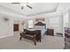 Spacious main bedroom featuring tray ceiling, carpet floors, and warm color palette at 5910 Roxboro Ct, Cumming, GA 30040