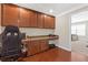 Office area featuring built-in cabinetry and a wood floor, perfect for a functional workspace at 5910 Roxboro Ct, Cumming, GA 30040