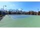 Community tennis courts featuring benches and net at 5910 Roxboro Ct, Cumming, GA 30040