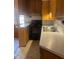 Classic kitchen featuring wood cabinets, white countertops, and an electric range at 1033 Mclendon Dr, Decatur, GA 30033