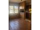 Interior view of the home showing the wood-paneled kitchen and window views at 1033 Mclendon Dr, Decatur, GA 30033