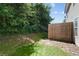 Fenced backyard with grass and woods, offering privacy and space for recreation at 162 Springbottom Dr, Lawrenceville, GA 30046