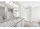 Bright bathroom featuring granite counters, white vanity, and tub shower combo at 162 Springbottom Dr, Lawrenceville, GA 30046