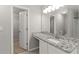 Bathroom vanity features granite counters and a view of a closet and a water closet at 162 Springbottom Dr, Lawrenceville, GA 30046