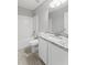 Bathroom featuring a tub, granite counters, white cabinets, and wood-look floors at 162 Springbottom Dr, Lawrenceville, GA 30046