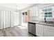 Kitchen area offers stainless steel dishwasher, granite counters, and a door to the backyard at 162 Springbottom Dr, Lawrenceville, GA 30046