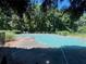 Community pool under a green cover and surrounded by green trees at 162 Springbottom Dr, Lawrenceville, GA 30046