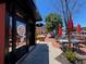 Restaurant exterior with outdoor seating, brick facade, inviting atmosphere and lush landscaping at 162 Springbottom Dr, Lawrenceville, GA 30046