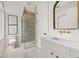 Bright bathroom featuring a glass-enclosed shower, modern fixtures, and a sleek vanity at 380 2Nd St, Fayetteville, GA 30214