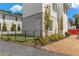 Modern exterior with manicured landscaping, featuring a mix of green grass, colorful flowerbeds, and mature trees at 380 2Nd St, Fayetteville, GA 30214