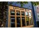 Leyland Blue storefront featuring large windows and a wooden framed entrance with dark blue painted brick at 380 2Nd St, Fayetteville, GA 30214