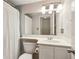 Bathroom featuring a vanity, large mirror with overhead lighting, and a shower with a curtain at 620 Peachtree Ne St # 1806, Atlanta, GA 30308