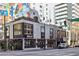 Corner view of a two-story commercial building with large windows and street view at 620 Peachtree Ne St # 1806, Atlanta, GA 30308