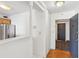 Hallway view of kitchen featuring stainless steel appliances and wood-look flooring at 620 Peachtree Ne St # 1806, Atlanta, GA 30308