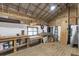 Rustic basement featuring a metal roof, wooden beams, and paneled walls at 1631 Dresden Ne Dr, Brookhaven, GA 30319