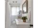 Bathroom featuring white tiling, vanity, and ample lighting at 1631 Dresden Ne Dr, Brookhaven, GA 30319