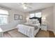 Cozy bedroom with neutral decor, ceiling fan, and hardwood floors at 1631 Dresden Ne Dr, Brookhaven, GA 30319