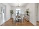 Traditional dining room with hardwood floors, a round table, and seating for four at 1631 Dresden Ne Dr, Brookhaven, GA 30319