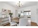 Traditional dining room with wood floors, a round table, and neutral-colored walls at 1631 Dresden Ne Dr, Brookhaven, GA 30319