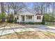 Charming home showcasing a cozy front porch and beautifully landscaped front yard at 1631 Dresden Ne Dr, Brookhaven, GA 30319