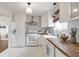 Bright kitchen features white cabinets, wood countertops, and white appliances at 1631 Dresden Ne Dr, Brookhaven, GA 30319