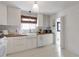 Bright kitchen with white cabinets, butcher block countertops and white appliances at 1631 Dresden Ne Dr, Brookhaven, GA 30319